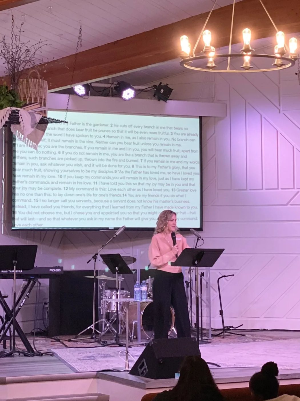 Valerie preaching from John 15 at a church